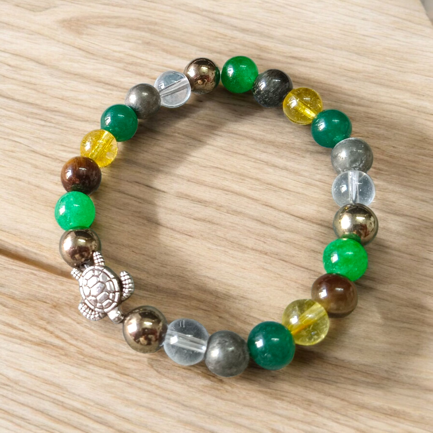 Image showing a stylish 8mm bead Money Magnet Bracelet with stretchable band, ideal for daily wear or gifting, placed on a clean background