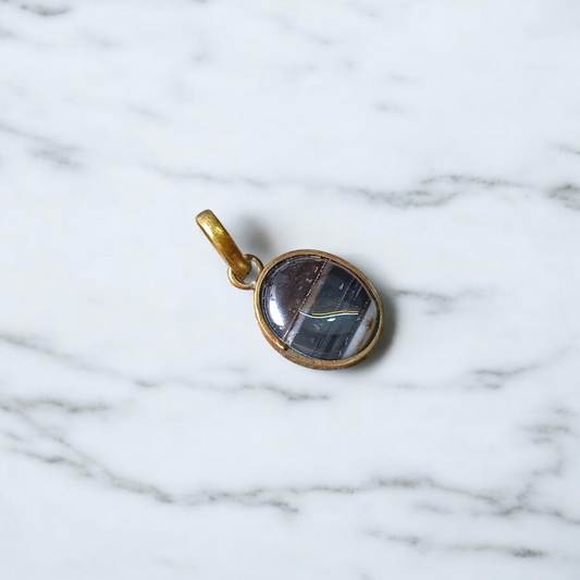 Lab-certified Black Sulemani Hakik gemstone pendant with black thread, known for protection and grounding benefits