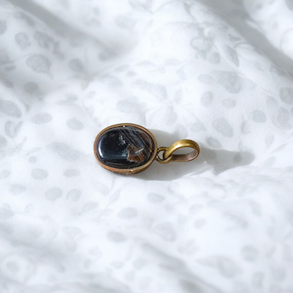 Lab-certified Black Sulemani Hakik gemstone pendant with black thread, known for protection and grounding benefits