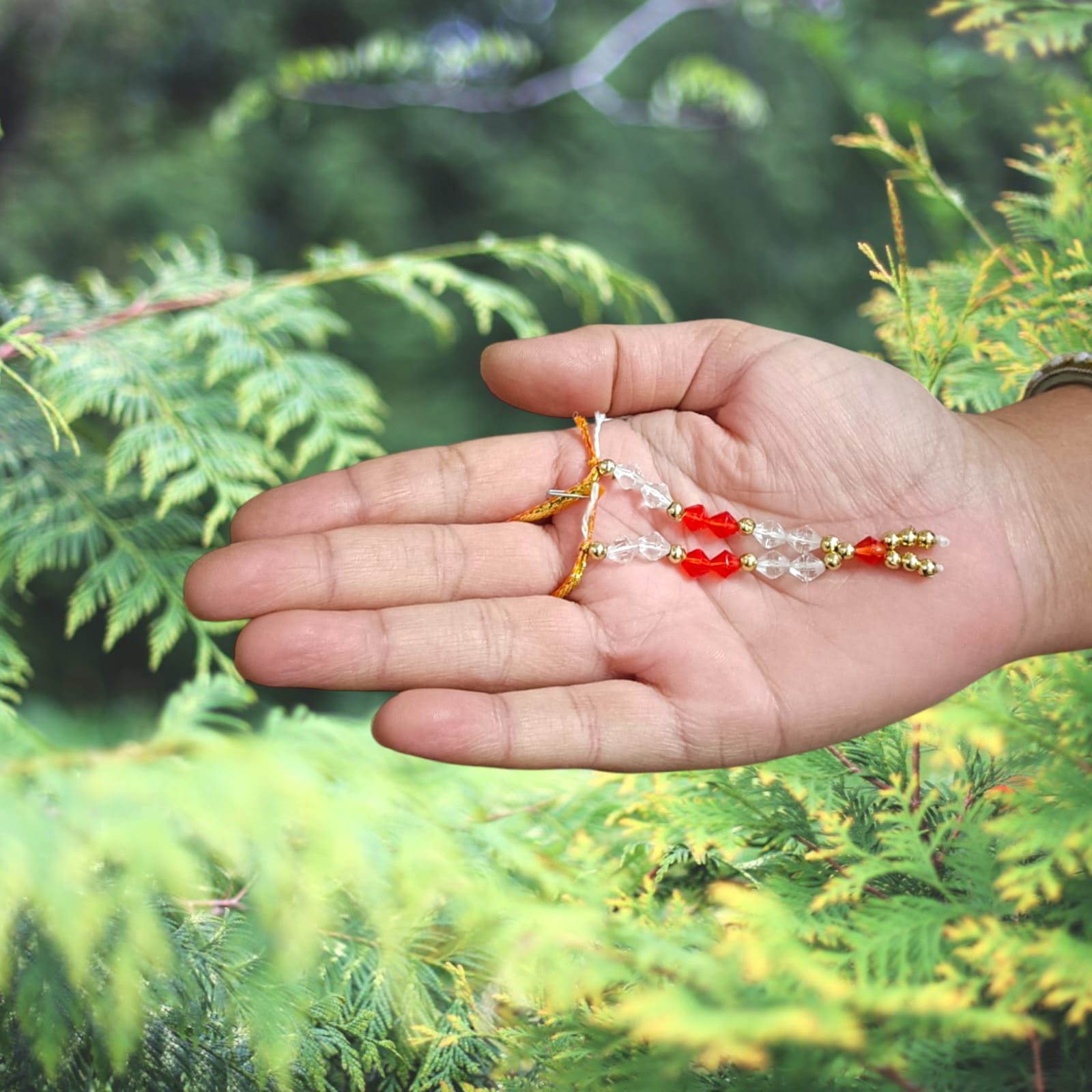 Laddu Gopal Mala with zircon beads in red, white, and golden colors, featuring an adjustable design, by Timeshopee