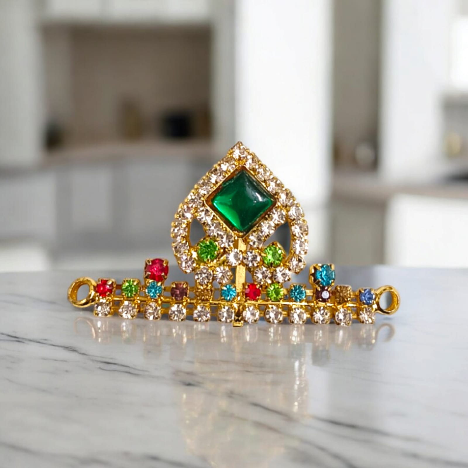 Laddu Gopal Mukut with Zircon Design in Red and Green colors, featuring an adjustable fit, by Timeshopee
