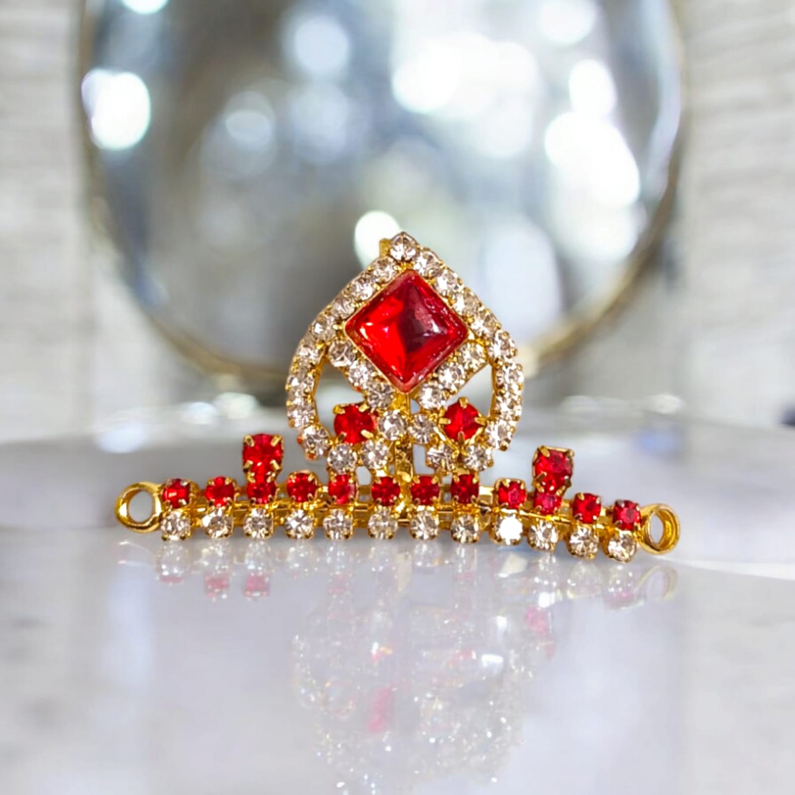 Laddu Gopal Mukut with Zircon Design in Red and Green colors, featuring an adjustable fit, by Timeshopee