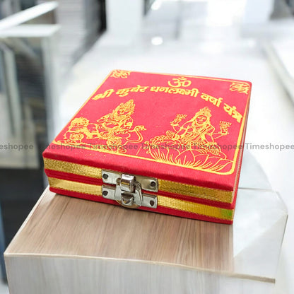 Lakshmi Kuber Box with various pooja items including idols, coins, yantra, and more, organized in a designed wooden box from Timeshopee