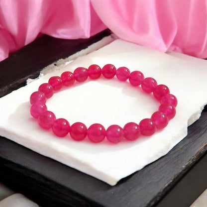 Light Pink ONYX Bracelet with lab certificate showing a close-up view of the elegant stretchable design.