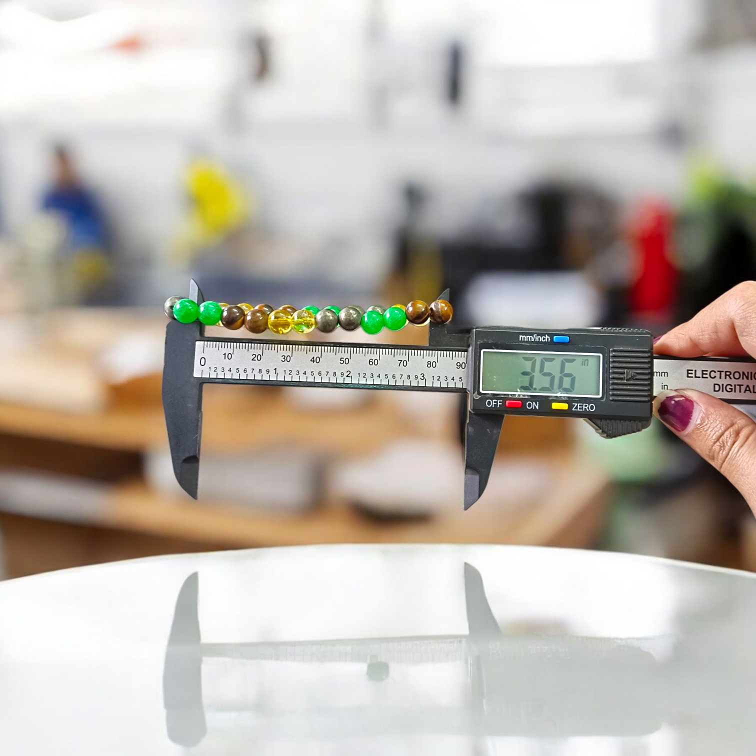 Money Magnet Bracelet made of 8mm lab-certified magnetic beads with stretchable design, used for attracting wealth, luck, and financial success