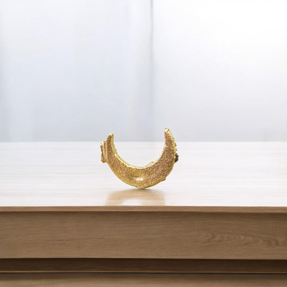 Moon-shaped Chand Tilak stamp tool used for Hindu rituals and daily prayers