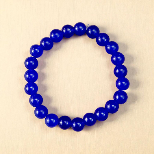 Natural Blue Agate (Hakik) Bracelet with 8mm round beads on a stretchable elastic cord, displayed in hand for spiritual and daily wear