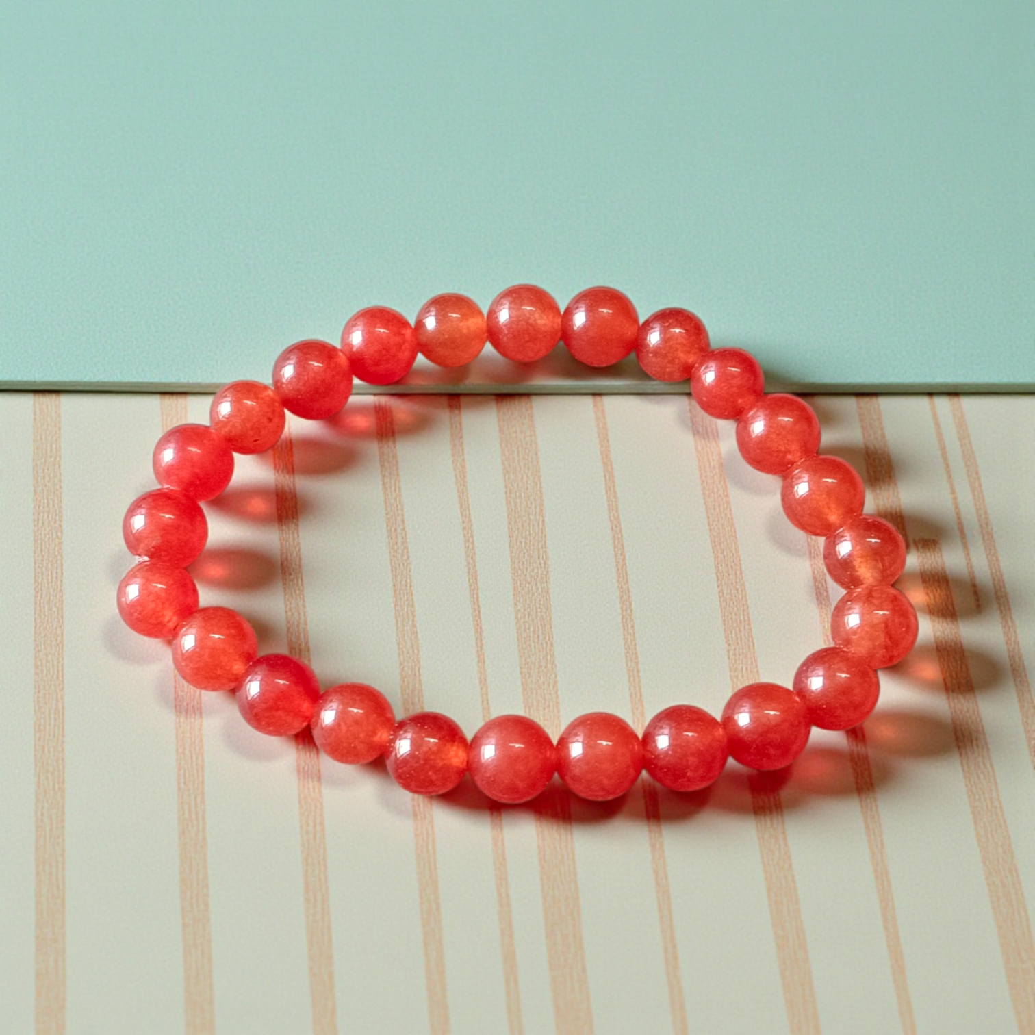 Natural Carnelian Bracelet with 8mm round beads, stretchable design, displayed neatly for wellness and fashion use