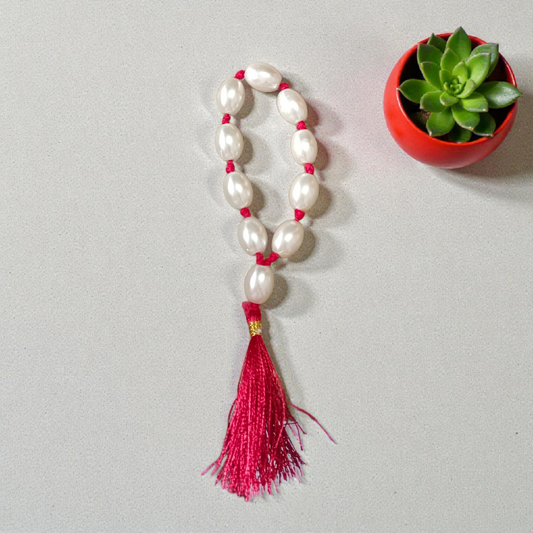 Natural Pearl Finger Mala with 9+1 round white pearls (10–11mm) displayed on a soft background, ideal for chanting and meditation