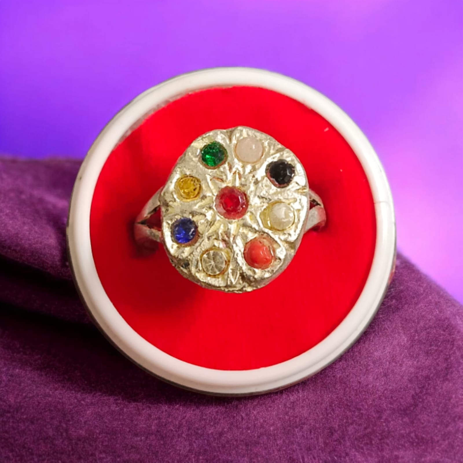 Oval-shaped Navratan Ring with silver plating, featuring nine gemstones for astrological balance and spiritual 