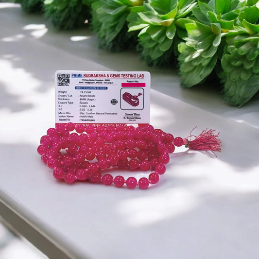 Pink Agate Mala with 8MM beads and 108+1 bead count, lab-certified for authenticity, displayed in a close-up view showing its delicate pink hues.