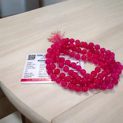 Pink Agate Mala with 8MM beads and 108+1 bead count, lab-certified for authenticity, displayed in a close-up view showing its delicate pink hues.
