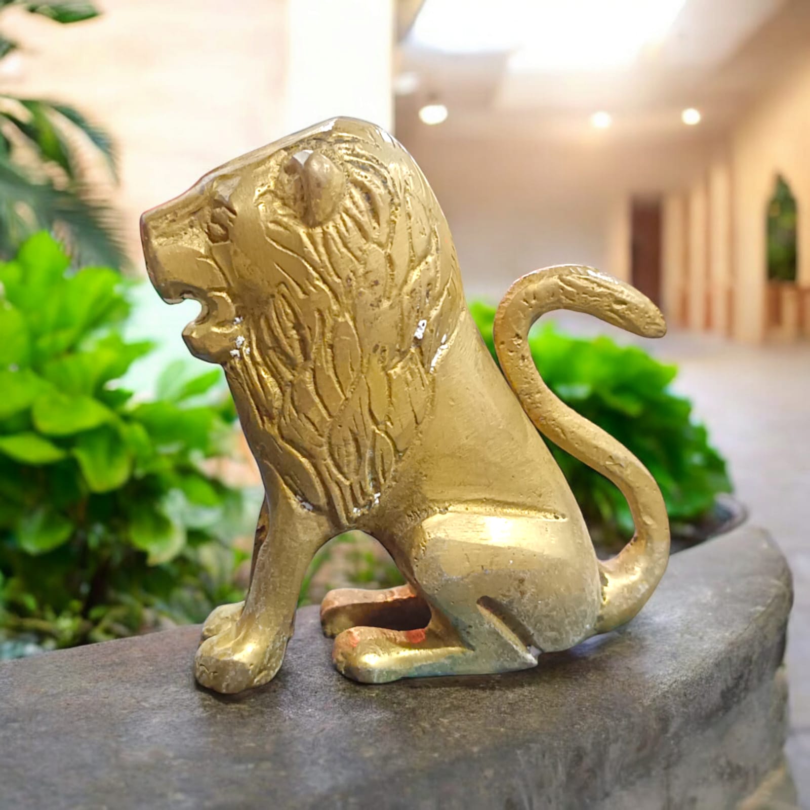Pure Brass Lion Idol with intricate craftsmanship, perfect for table or temple decoration.