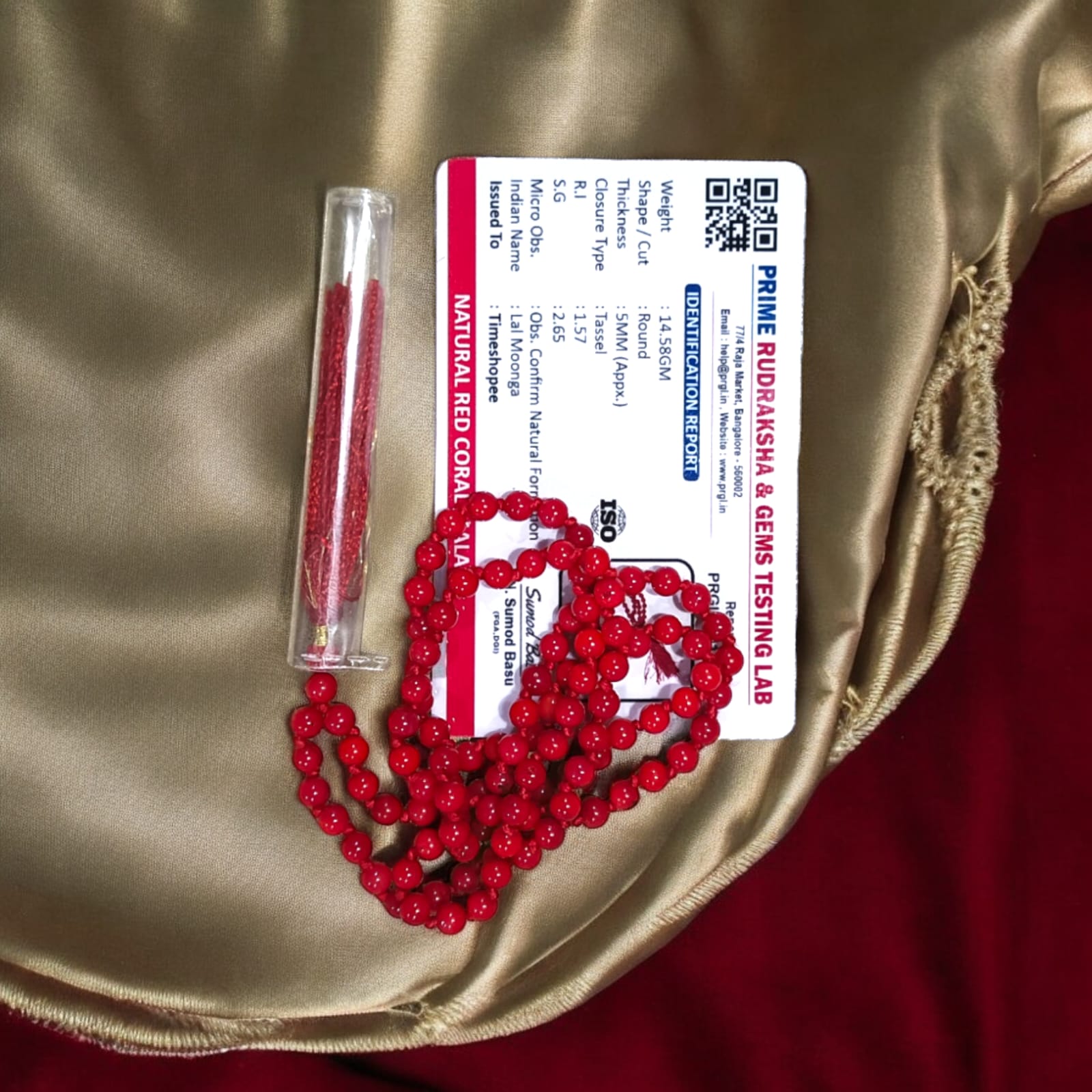 Red Coral Mala with 5MM beads and 108+1 bead count, lab-certified for authenticity, displayed in a close-up view showcasing its vibrant red color.