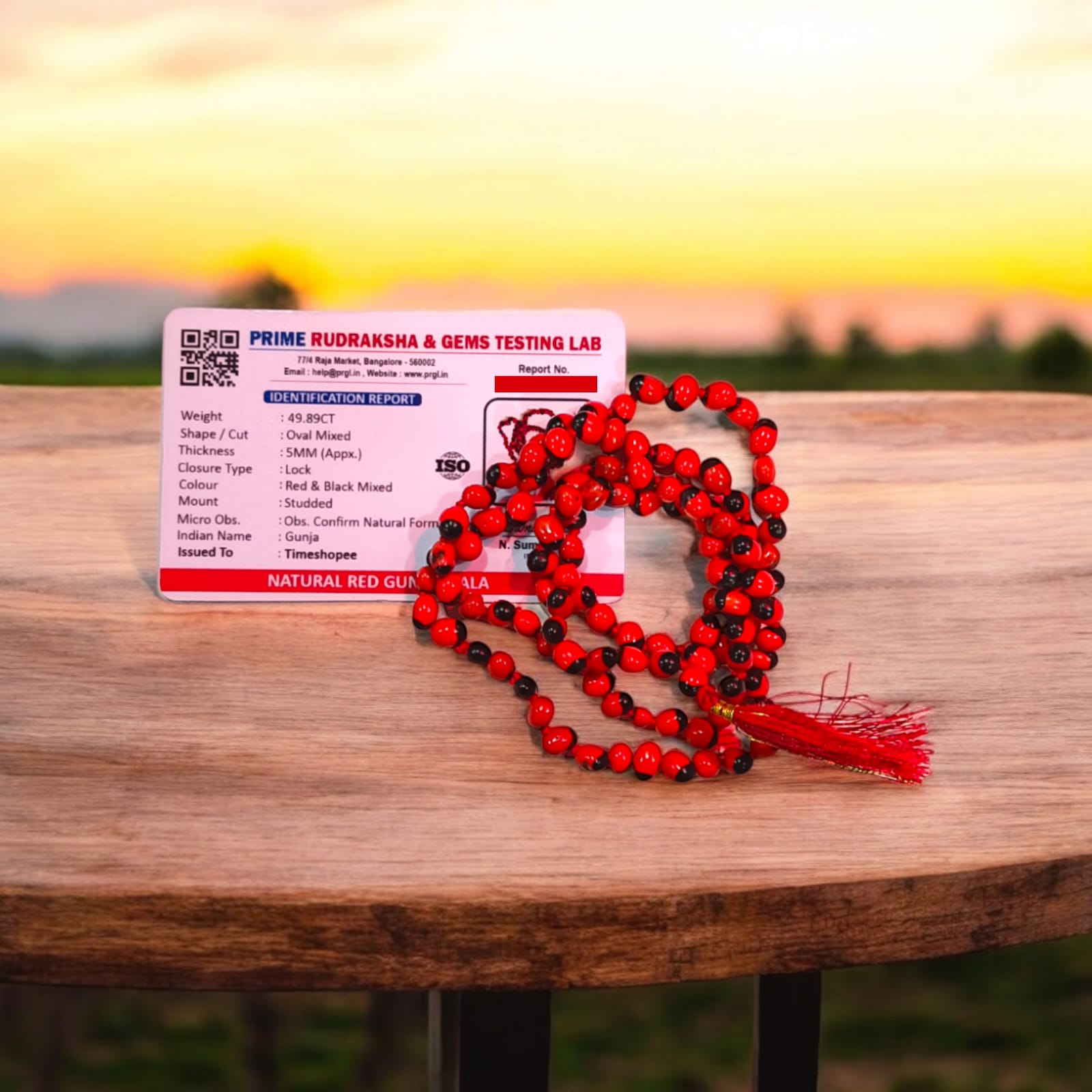 Red Gunja Mala displayed with its vivid red beads, illustrating its 100% original quality and lab certification for purity.