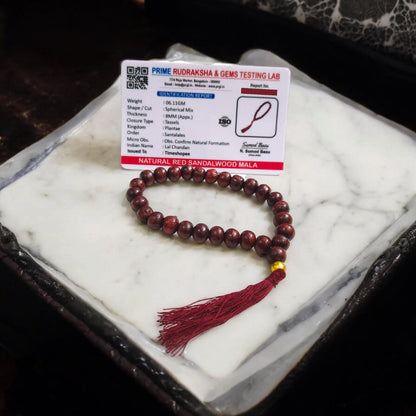 [Red Sandalwood Mala with 108 beads, handcrafted and lab-certified, placed on a white background]

