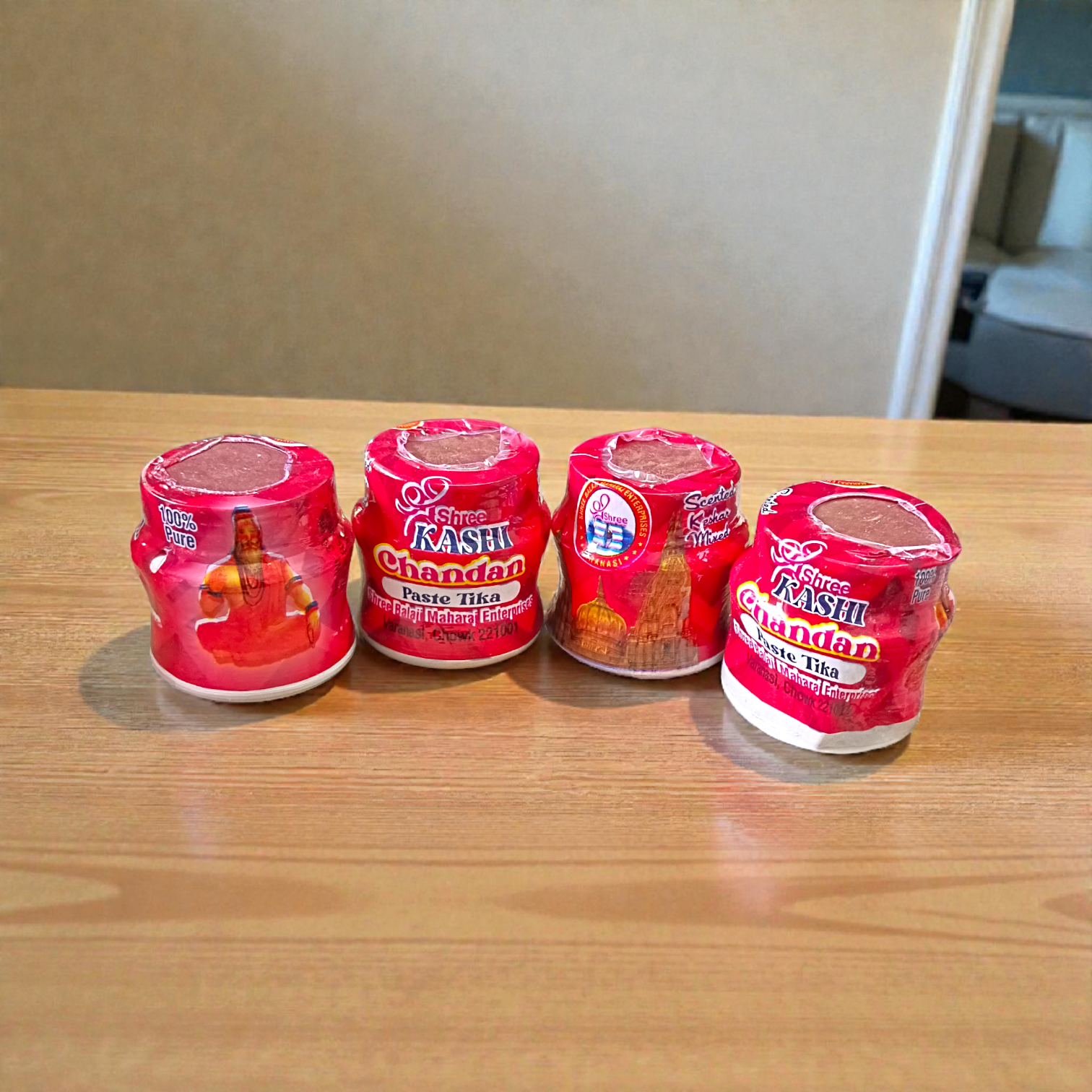 Red chandan paste container used for tilak, puja, and religious rituals