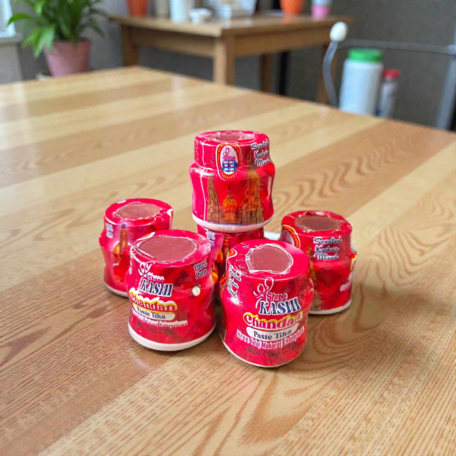 Red chandan paste container used for tilak, puja, and religious rituals