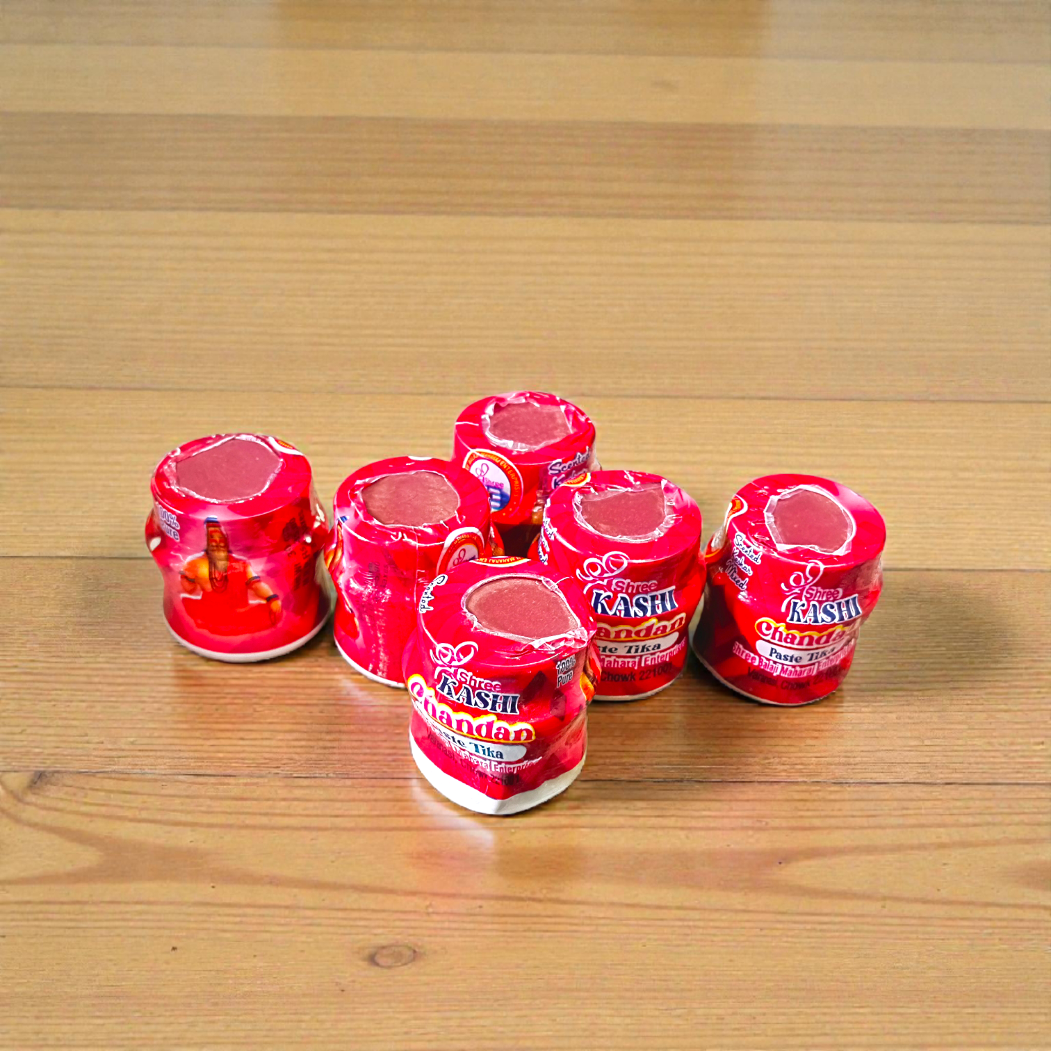 Red chandan paste container used for tilak, puja, and religious rituals