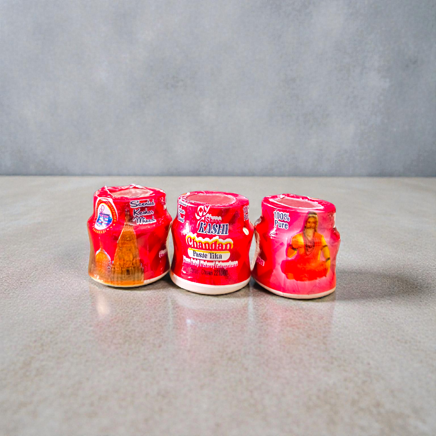 Red chandan paste container used for tilak, puja, and religious rituals