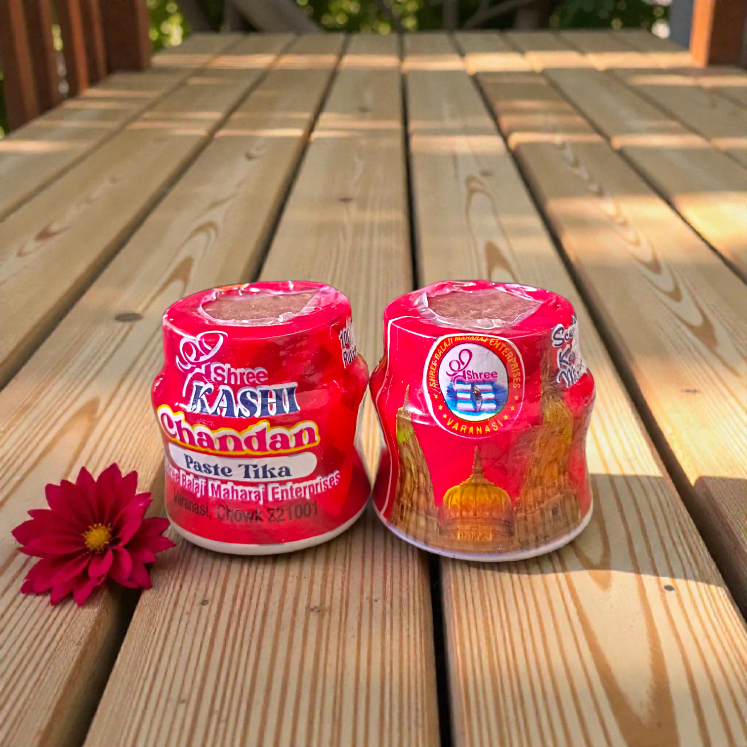 Red chandan paste container used for tilak, puja, and religious rituals