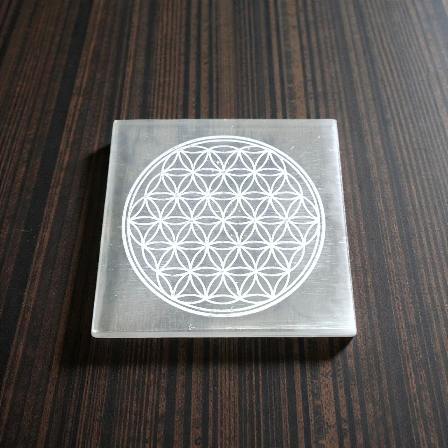 Selenite Crystal Charging Plate engraved with Flower of Life for crystal cleansing, recharging, meditation, and energy work