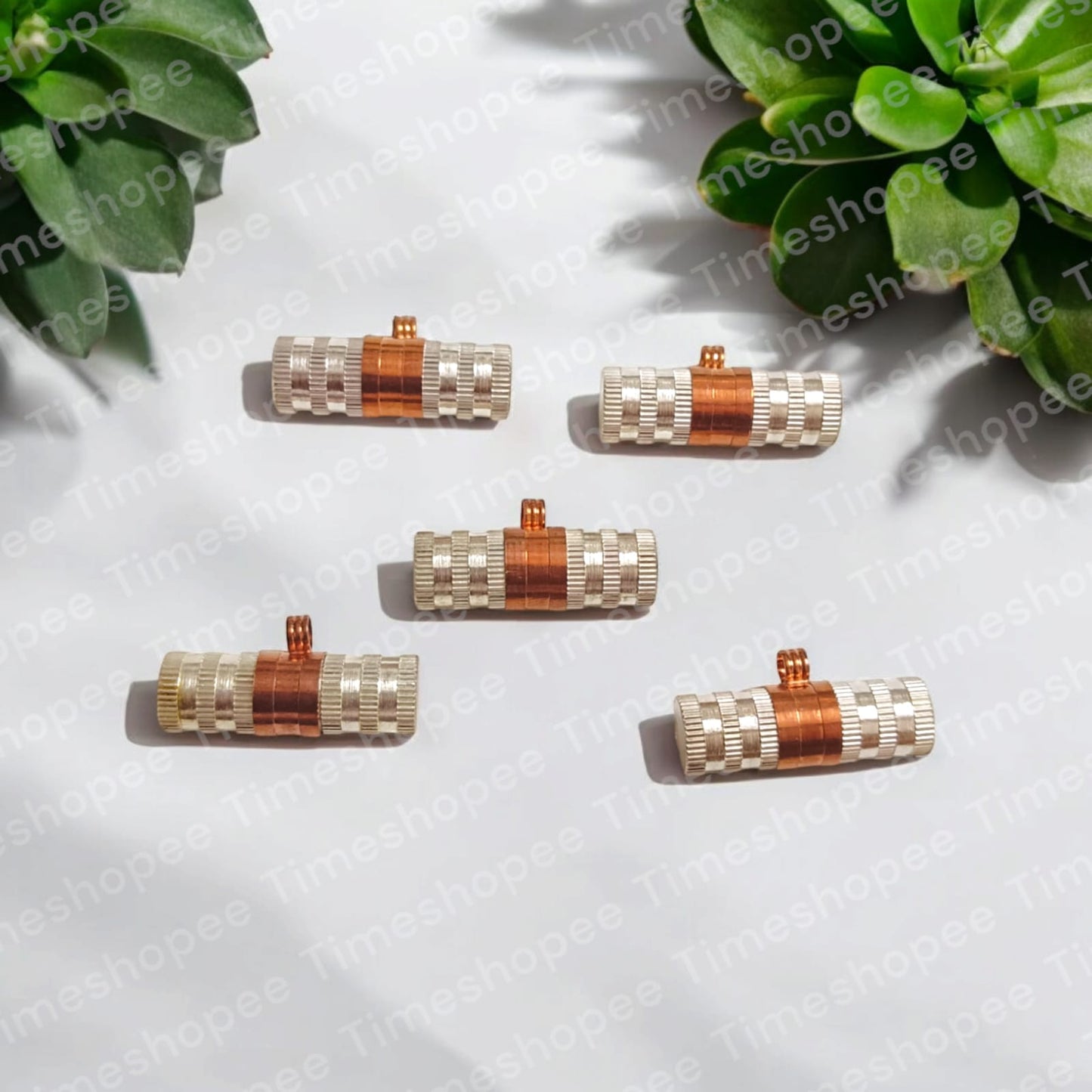 Set of Pure Copper and Silver taweezes with Bhojpatra sheet, displayed elegantly on a neutral background
