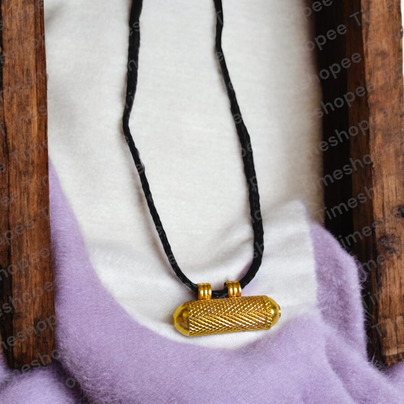 Set of Pure Golden metal taweezes with Bhojpatra sheet, displayed elegantly on a neutral background