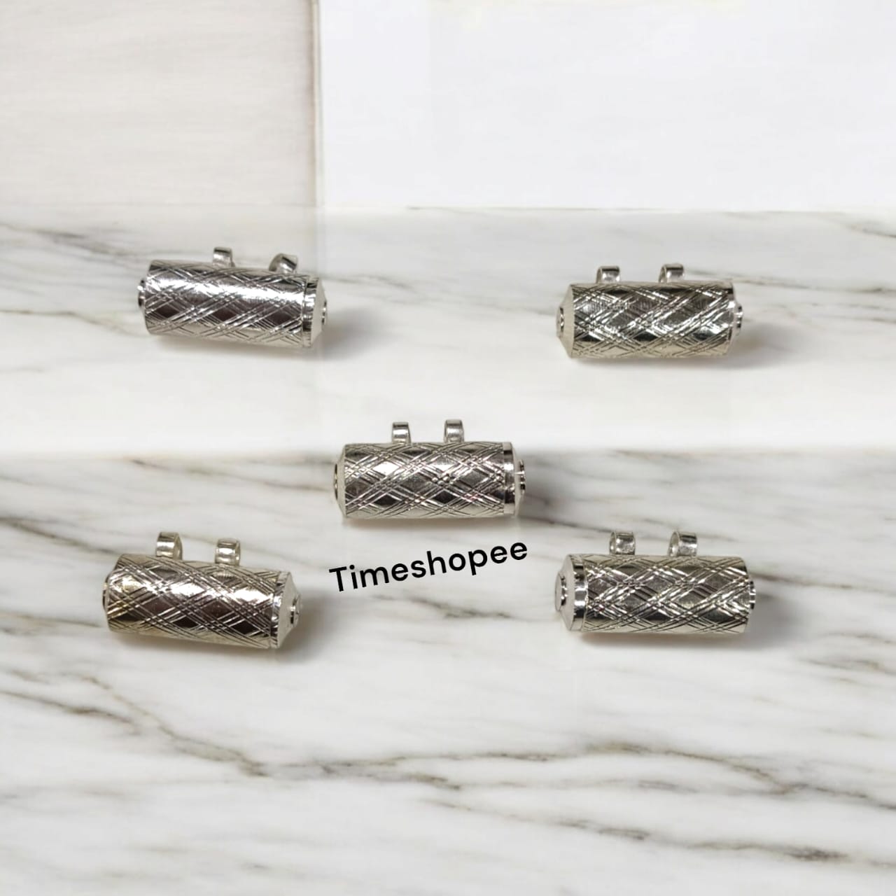 Set of five large silver metal taweez amulets, each approximately 23.3mm, with a free Bhojpatra sheet, showcasing their elegant design and spiritual significance.