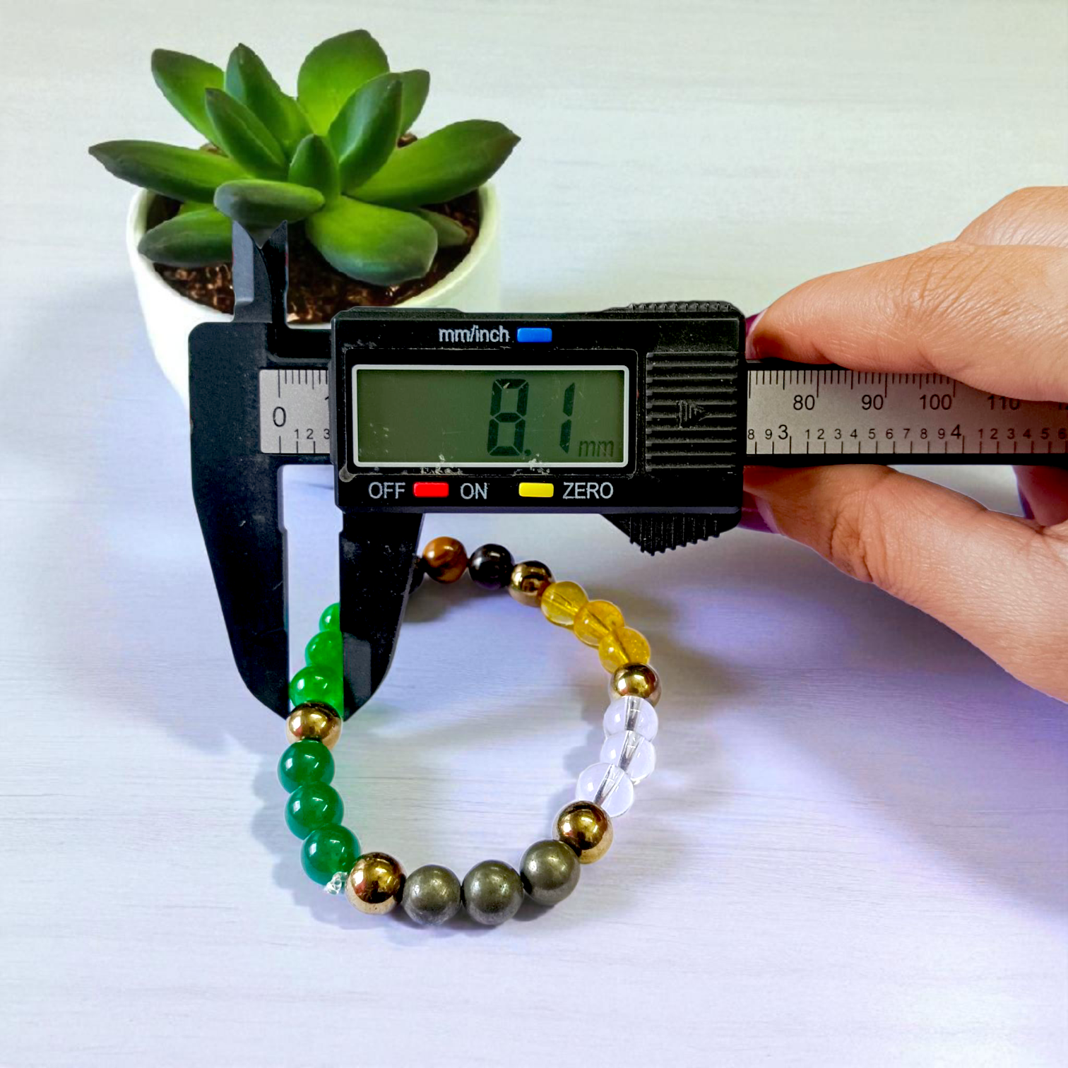 Spiritual Money Magnet Bracelet with 8mm Lab Certified Magnetic Beads on a stretchable band, ideal for meditation and daily wear