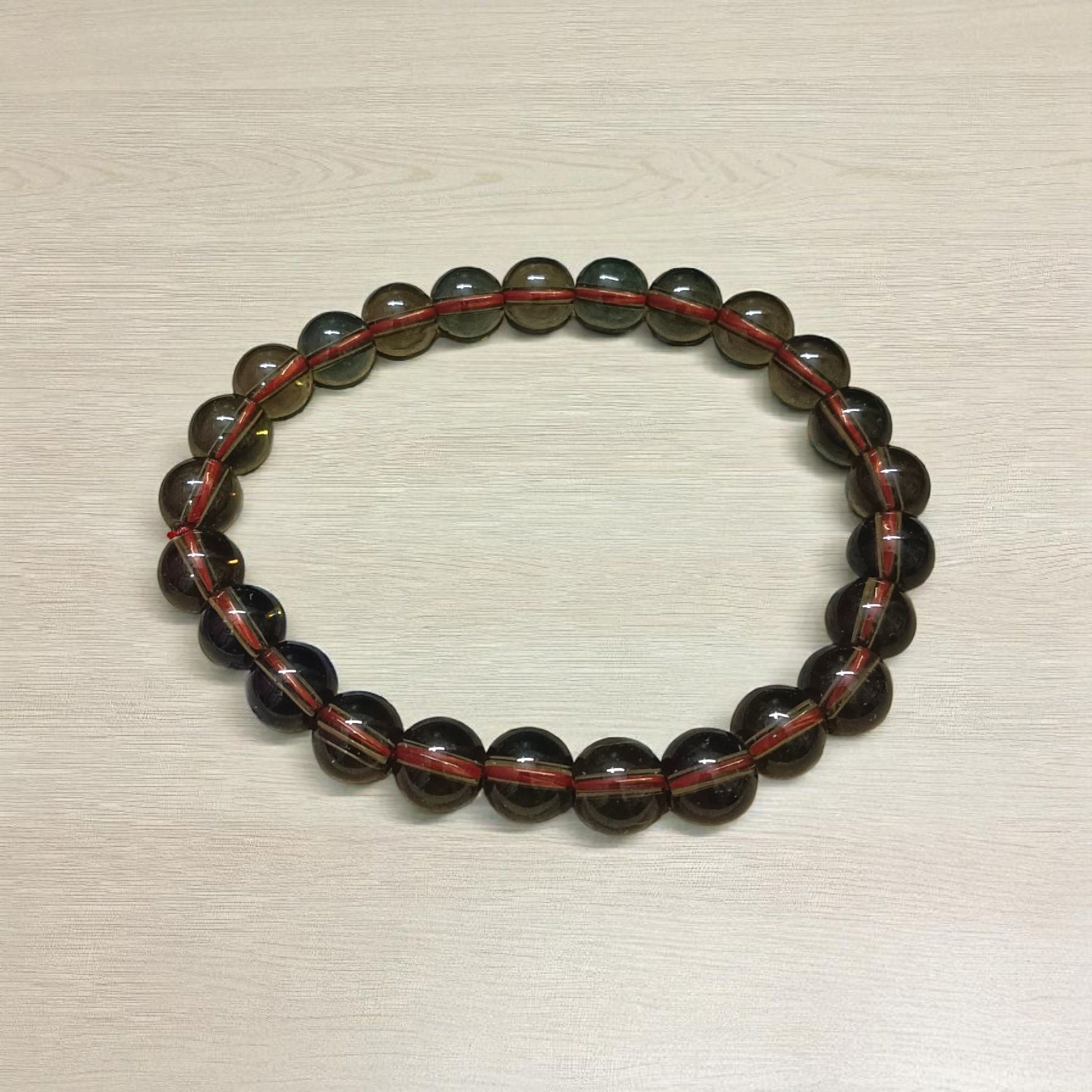 Stretchable Natural Smokey Quartz Bracelet made with 8mm round beads, suitable for men and women, displayed on a white background