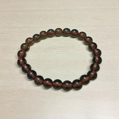 Stretchable Natural Smokey Quartz Bracelet made with 8mm round beads, suitable for men and women, displayed on a white background