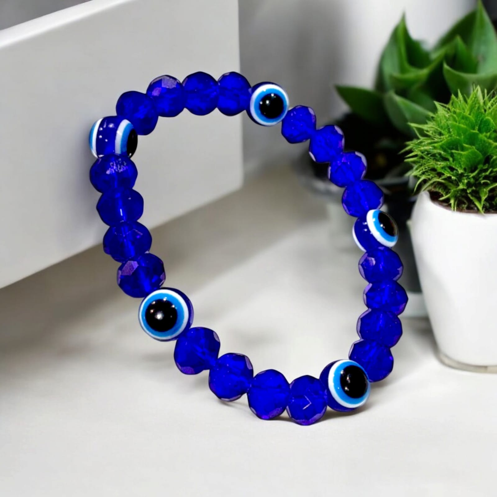 Stretchable Nazar Suraksha Bracelet with evil eye charm, designed for unisex wear.