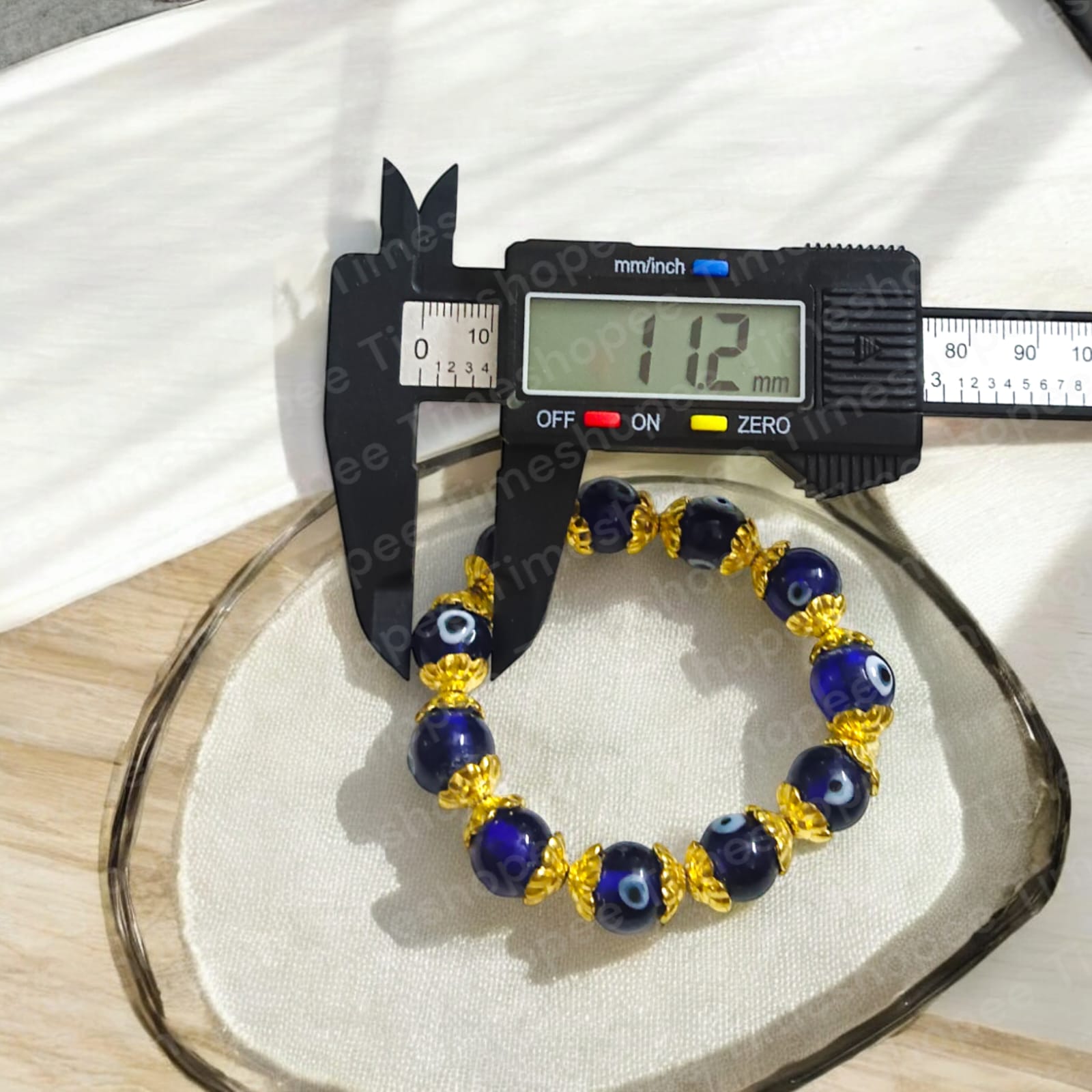 Stretchable Nazar Suraksha Bracelet with evil eye charm, designed for unisex wear.