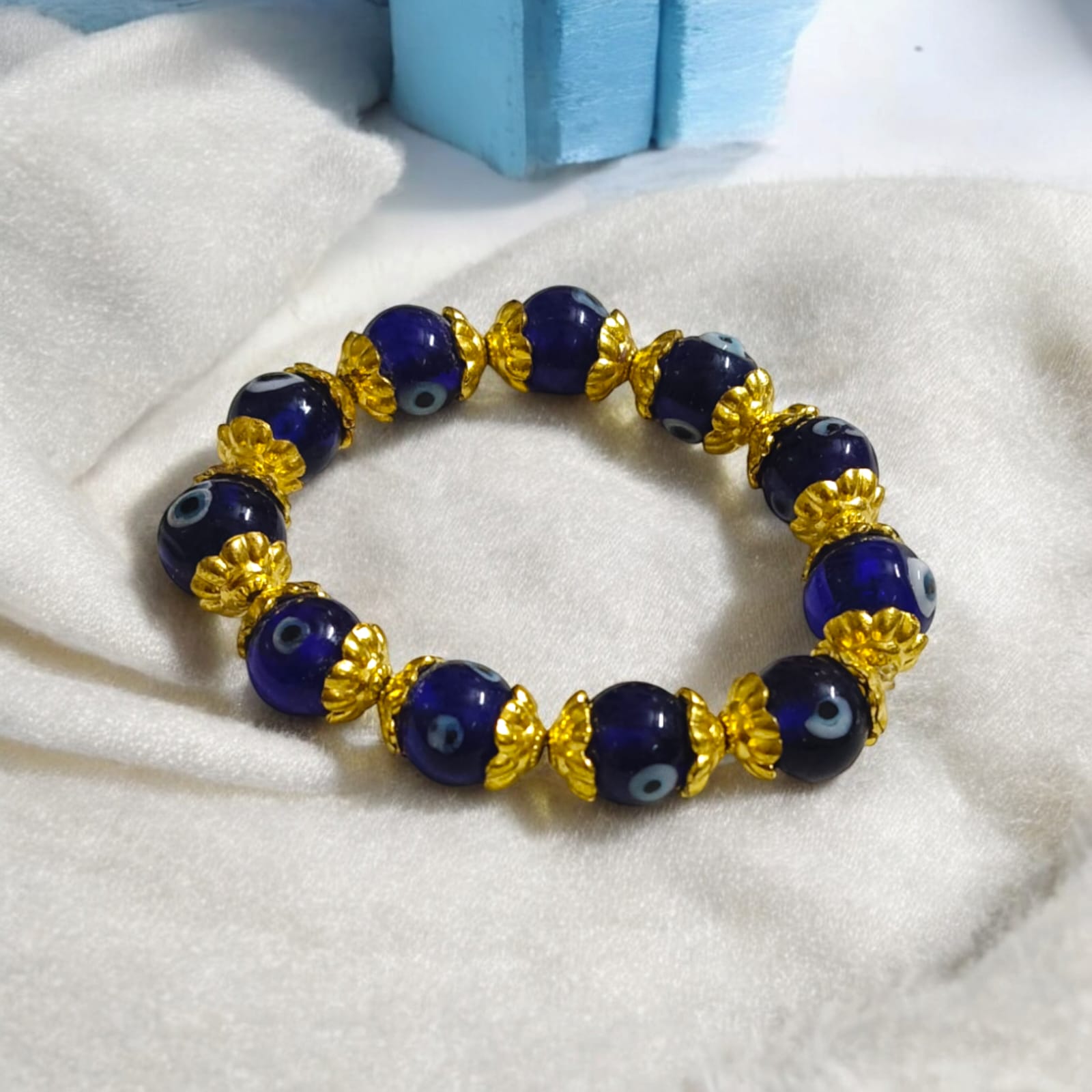 Stretchable Nazar Suraksha Bracelet with evil eye charm, designed for unisex wear.