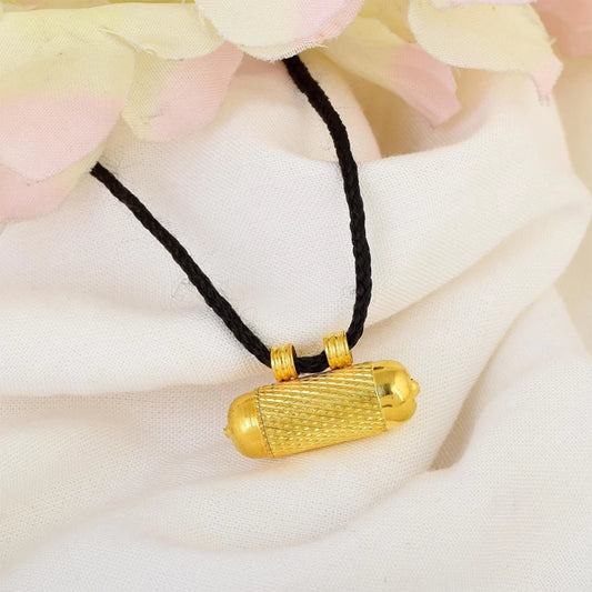 Stylish taweez featuring yantra inscribed on Bhojpatra, blessed by Goddess Kali for business and job growth.