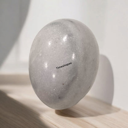 White and Black Shivling Stone for Tulsi and temple worship, representing Lord Shiva with an elegant dual-tone marble design.