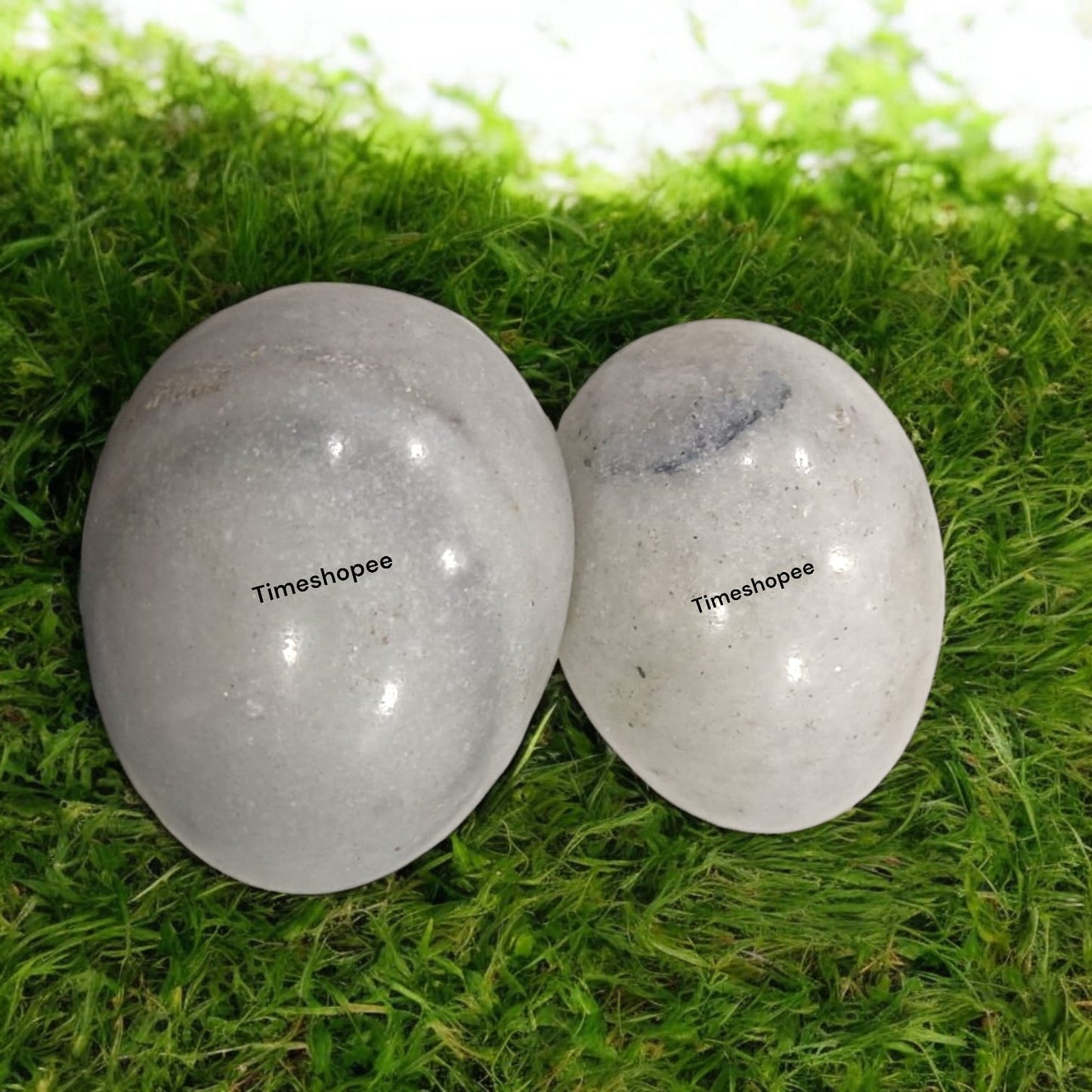 White and Black Shivling Stone for Tulsi and temple worship, representing Lord Shiva with an elegant dual-tone marble design.