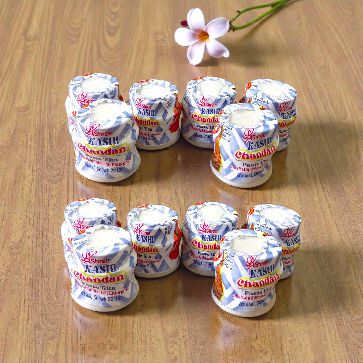 White chandan paste container used for tilak, puja, and religious rituals