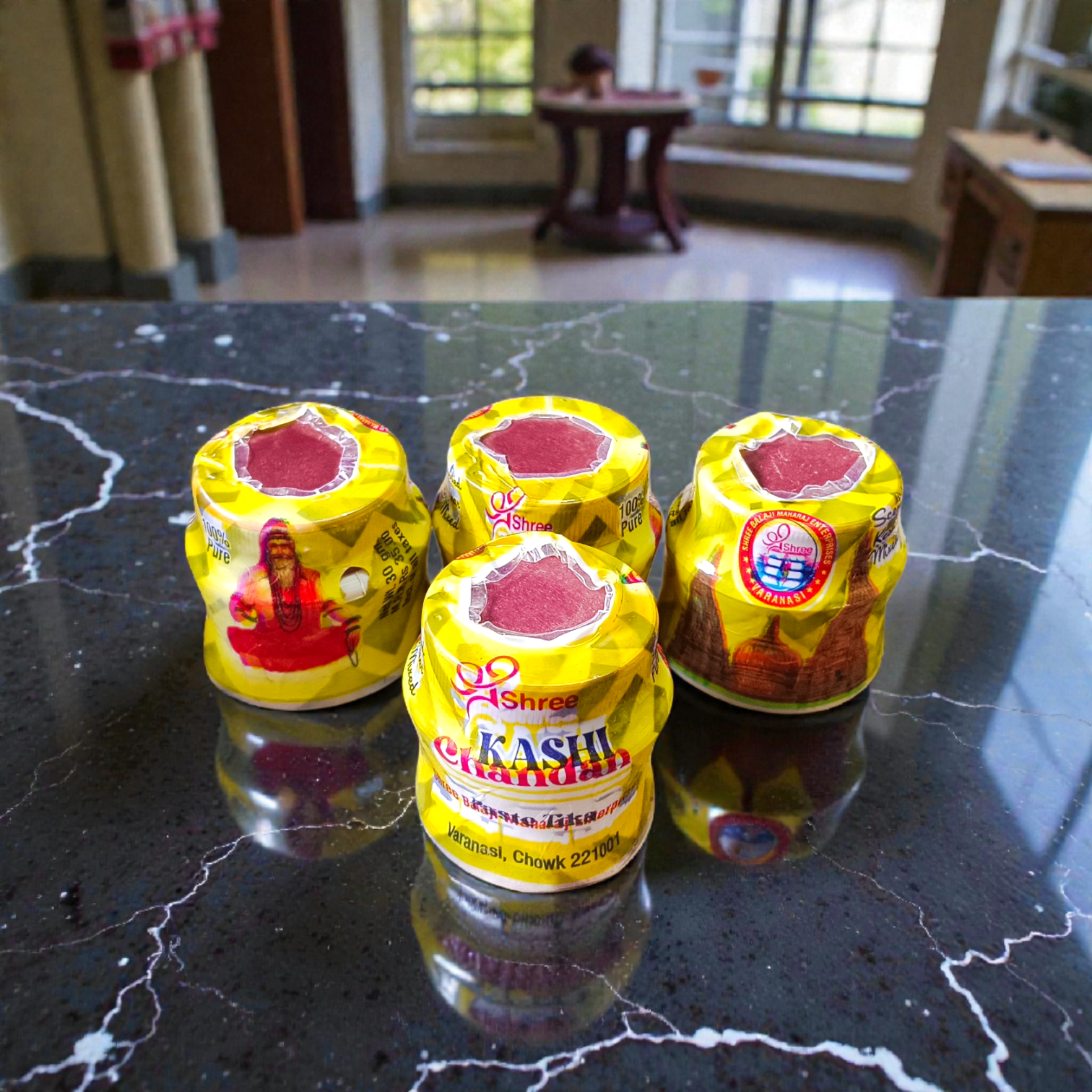 Yellow sandalwood chandan paste container used for tilak and puja