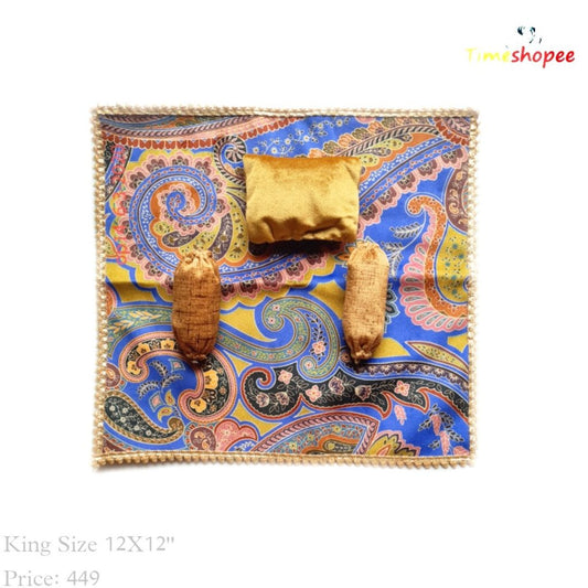 A luxurious 12X12 inch premium velvet bedsheet set with a pillow and blanket for Laddu Gopal, available in six stylish designs, ensuring comfort and elegance in your pooja area.