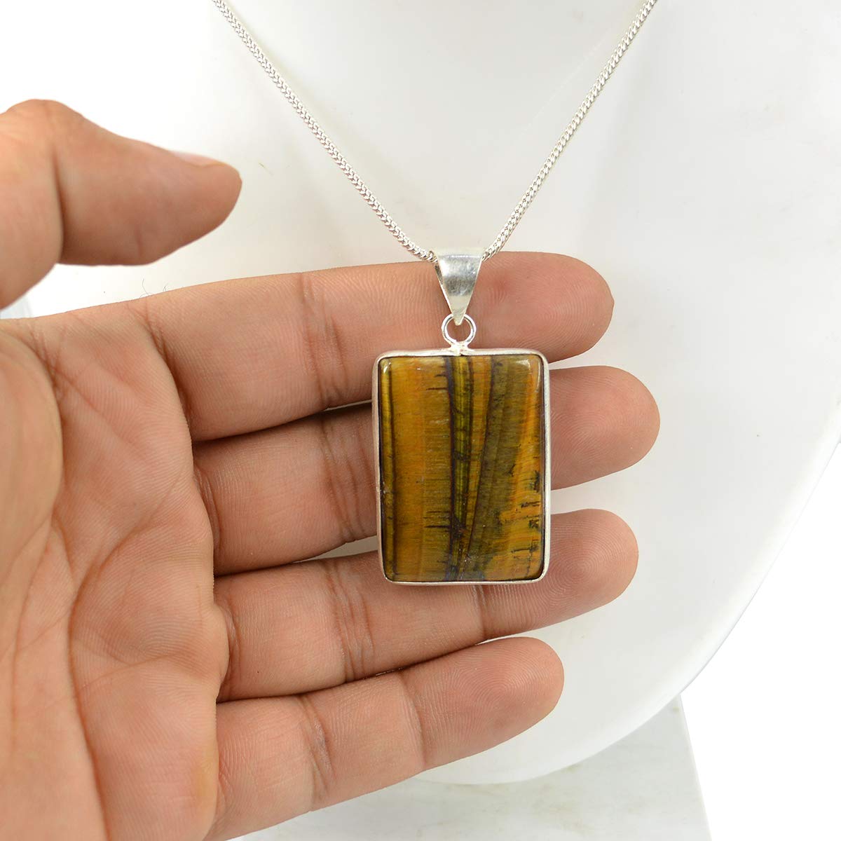 Lab-certified Tiger Eye Pendant with chain, featuring a golden-brown gemstone known for its grounding and protective properties.