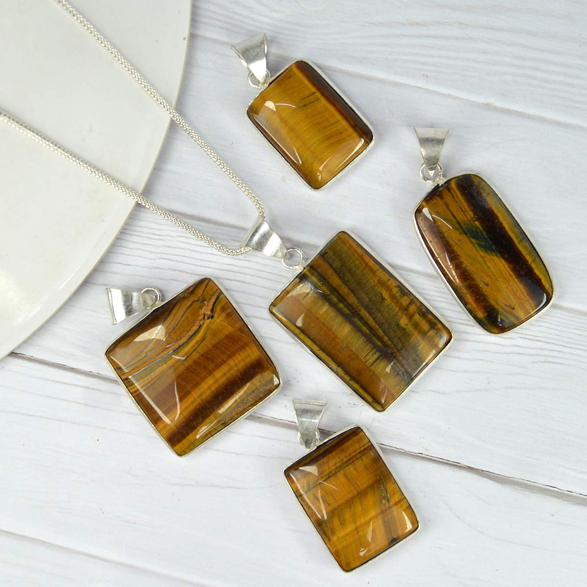 Lab-certified Tiger Eye Pendant with chain, featuring a golden-brown gemstone known for its grounding and protective properties.